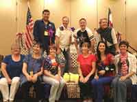 First Row: Joanne Brady, Martha Ogasawara, Jill Babinec, Michele Burton, Jo Thompson-Szymanski, Juliet Hauser - Second Row: Ruben Luna, Michael Diven, John Robinson, & Michael Barr at Pikes Peak Line Dance or Bust - 2016 in Colorado Springs, CO